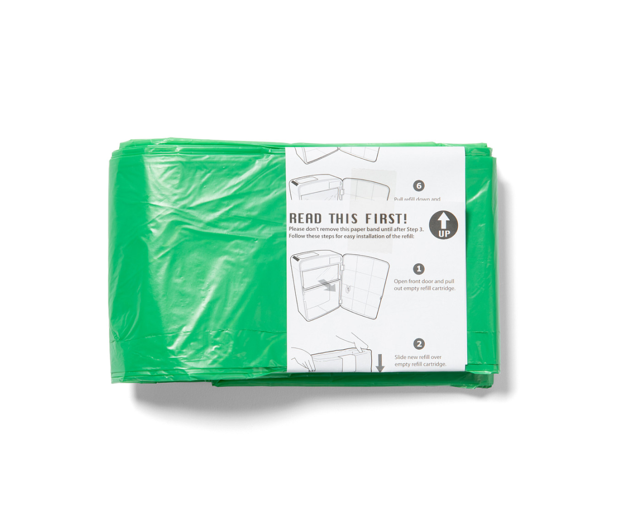 Green plastic bag with a white label on a white background